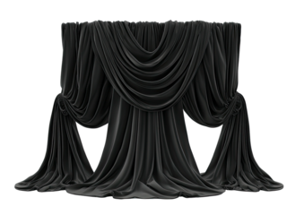 Dramatic black fabric draped theatrically against a black background