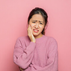Face expression suffering from sensitive teeth, Asian young woman touching cheek