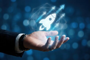 Business hand with holographic rocket on blue background, glowing startup launch icon hovering above palm, digital interface symbolizing innovation, growth and success

