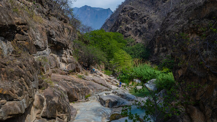 Jagueyes de Mayascon, a natural oasis with crystal clear pools surrounded by mountains in Lambayeque, Peru