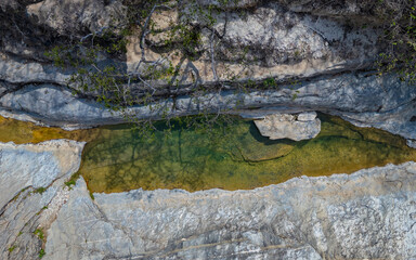 Obraz premium Jagueyes de Mayascon, a natural oasis with crystal clear pools surrounded by mountains in Lambayeque, Peru