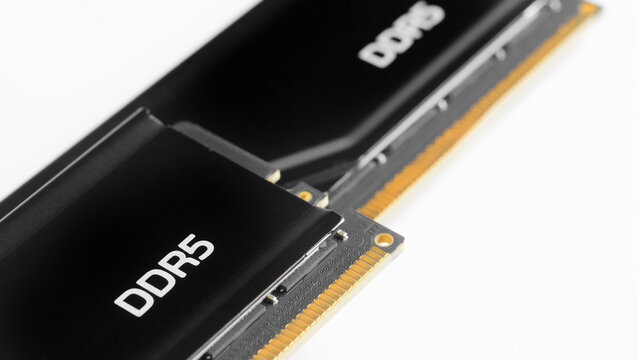 Close-up of two modern DDR5 random access memory modules isolated on white. High-speed computer hardware component for gaming PC upgrade. Photo
