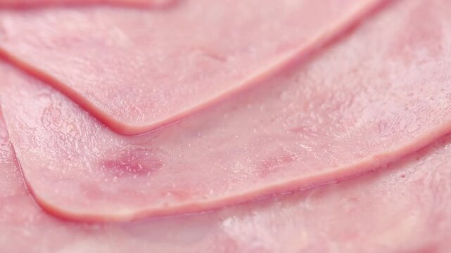 Pile of cooked Ham Sliced Rotating. Extreme Close-Up view