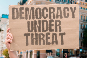 "Democracy Under Threat" Electoral systems face serious challenges. ELECTORAL. SYSTEMS. FACE. SERIOUS. CHALLENGES.