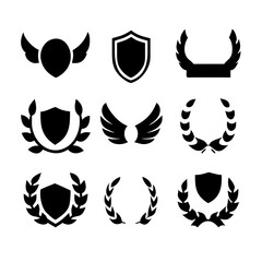 Fototapeta premium Collection of vector heraldic elements including laurel wreaths shields wings and ribbons perfect for creating logos or designs