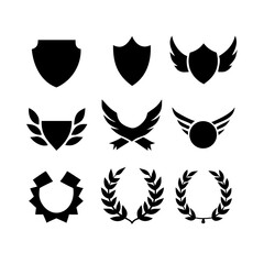Fototapeta premium Collection of vector heraldic elements including laurel wreaths shields wings and ribbons perfect for creating logos or designs