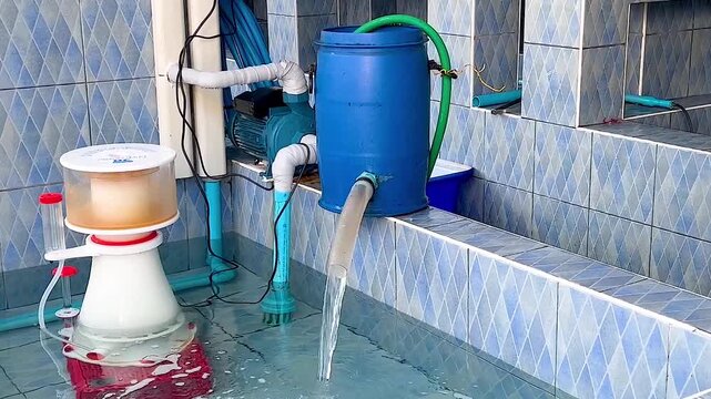 Water Filtration System with Blue Tank and Protein Skimmer in Operation