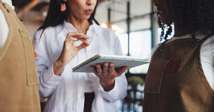 Hands, restaurant team and meeting with tablet for inventory checklist, staff schedule or review supplier info. People, waiters and owner with digital tech for menu planning, cafe agenda or budget - Powered by Adobe