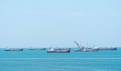 Fototapeta premium The ship on the ocean on sunny day.