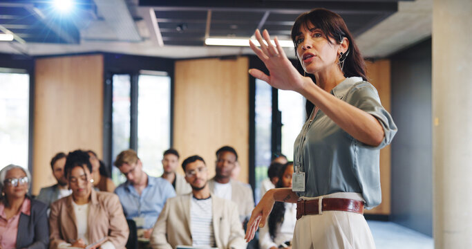 Business woman, presentation and group at convention for corporate training, upskill workshop or conference. Mature female, audience and speaker with insight for professional development at seminar
