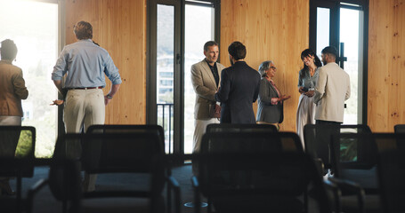 Conference, people and discussion for venture, networking and partnership for global trade at event. Group, talking and plan for foreign investment, colleagues and collaboration in seminar or meeting