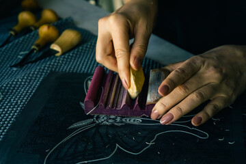 Linocut artist hand curving printmaking hobby