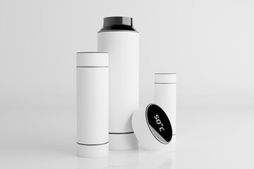 Collection of modern white insulated tumblers and water bottles with digital temperature display