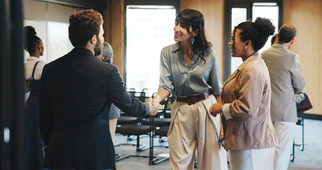 People, handshake and smile for seminar, talk and greeting for networking event, meeting or...