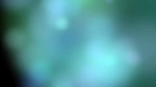 Abstract bokeh background transitions from muted to vibrant colors