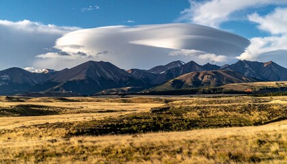 Obraz premium Mountain Range with Cloudy Sky Landscape.