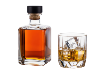 Elegant clear glass whiskey bottle and faceted tumbler with golden-brown liquor and square ice cubes on a transparent studio background with copy space, Concept for premium beverage advertising