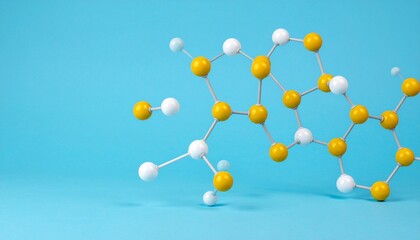 Molecular model with yellow and white atoms on blue