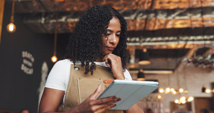 Thinking, woman and barista with tablet in restaurant with ideas for online menu or inventory. Planning, digital technology and female waitress with stock list order on website for coffee shop.