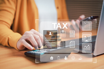 Digital tax management concept with freelancer calculating tax using calculator, laptop, and smartphone. Personal finance, online tax filing, and fintech accounting workflow