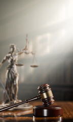 Legal Concept: Themis is the goddess of justice and the judge's gavel hammer as a symbol of law and order on the background of books