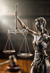 Legal Concept: Themis is the goddess of justice and the judge's gavel hammer as a symbol of law and order on the background of books