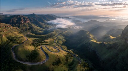 Scenic Mountain Road with Sunrise and Mist.