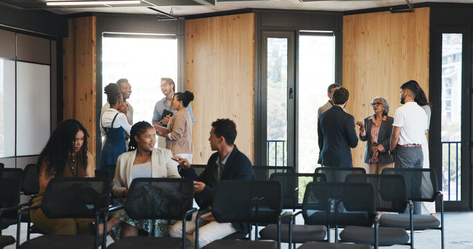 Business people, meeting or group in lobby for conference, upskill workshop or corporate training seminar. Colleagues, employees and conversation in foyer for professional development at convention