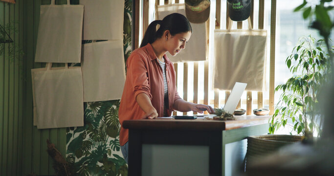 Reading, laptop and plant with woman in store for delivery checklist, email and botany review. Order confirmation, sustainability and entrepreneur with person and tech in eco friendly small business