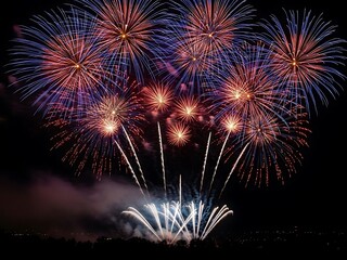 Spectacular fireworks display illuminating the night sky with vibrant colors and dazzling explosions
