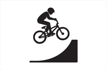 Obraz premium A silhouette of a cyclist performing a jump on a ramp