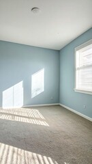 Empty, blue-walled room; sunlight and shadow on floor