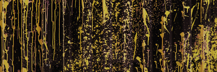 Gold Or Bronze Paint Splatter on Dark Corrugated Metal Background. Abstract surface.