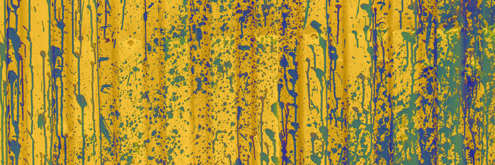 Yellow and Blue Paint Splatter on Corrugated Metal. Colored abstract backdrop.