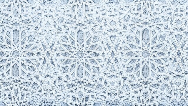 Ornate light-toned architectural detail featuring intricate repeating star and interlacing motifs, creating an elegant and traditional geometric pattern background