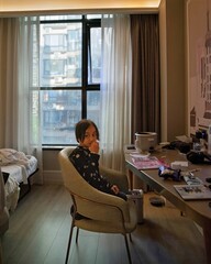 China, Shanghai&mdash;December 8, 2024: Little girl eating snacks in Mercure Hotel.