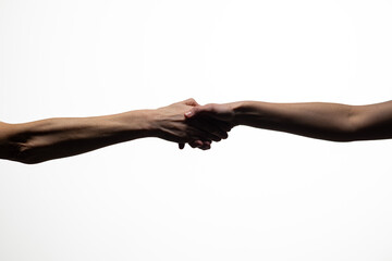 Two hands clasping in a handshake, symbolizing agreement, unity, or trust, against a white background. Includes copy space for text or design elements