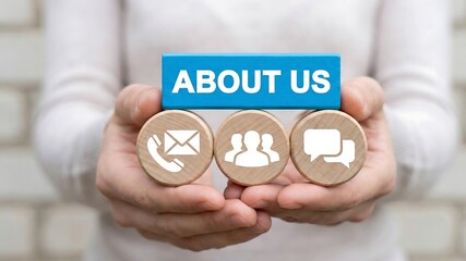 About us and contact us business web concept. Business person holding blocks with icons sees the inscription ABOUT US  ,business, concept, 