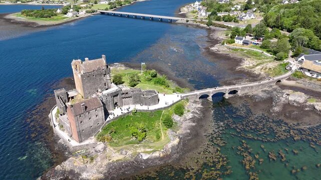 Aerial footage of Eilean Donan Castle landmark, Scotland, United Kingdom