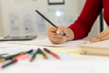 Creative web designer planning UI application and developing digital template