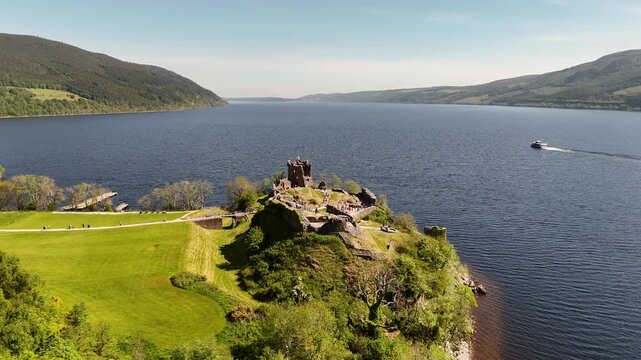 Drone shot of Urquhart Castle beside Loch Ness, Scotland, United Kingdom