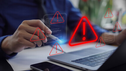 Ransomware malware attack and data breach: businessman using laptop with spam virus warning and caution notification for internet security protect