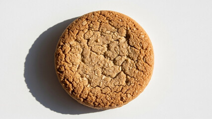 Top View of a Round Golden Oat Biscuit Cookie on a White Background