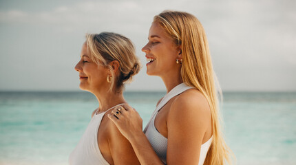 Elegant women enjoying a beachside moment showcasing luxury white apparel and jewelry