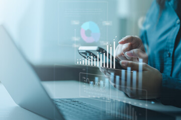 A fintech analytics scene showing a person reviewing financial data on a smartphone with digital charts, graphs, and metrics, representing online finance, investment insights, and data visualization.