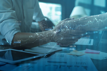 A global trade and business partnership concept showing a handshake over financial charts and digital world map graphics, representing international cooperation, investment, and economic connection.
