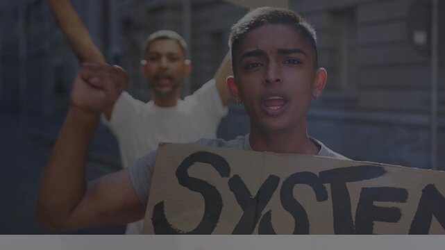 Diverse group of angry activists holding cardboard banners while giving slogans in protest march