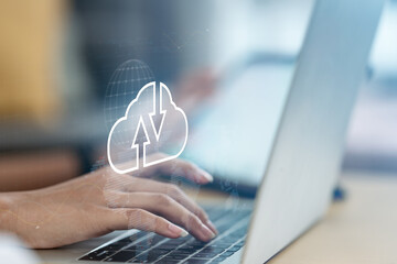 Cloud computing concept with data upload and download icon over laptop, representing virtual servers, global network connection, data storage, and scalable digital infrastructure.