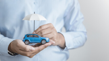 Car insurance protection concept showing a vehicle covered with care and security, representing financial protection, risk management, coverage policy, and trust in auto insurance services.