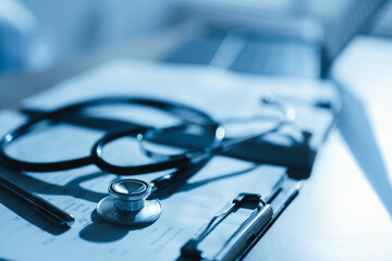 Close-up of a stethoscope on medical documents representing healthcare service, diagnosis, and professional consultation in a modern clinic or hospital, highlighting trust, treatment, and health.